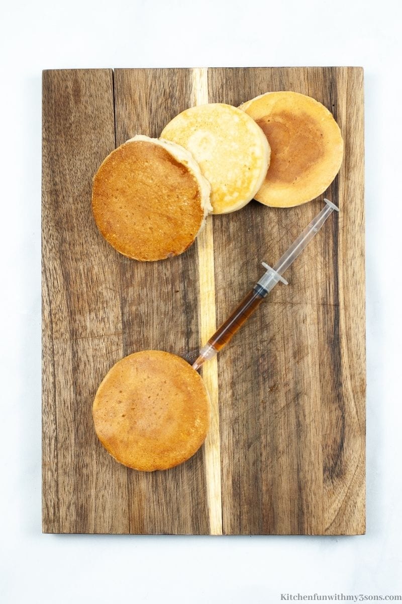 Infusing the pancakes with syrup in a syringe. 