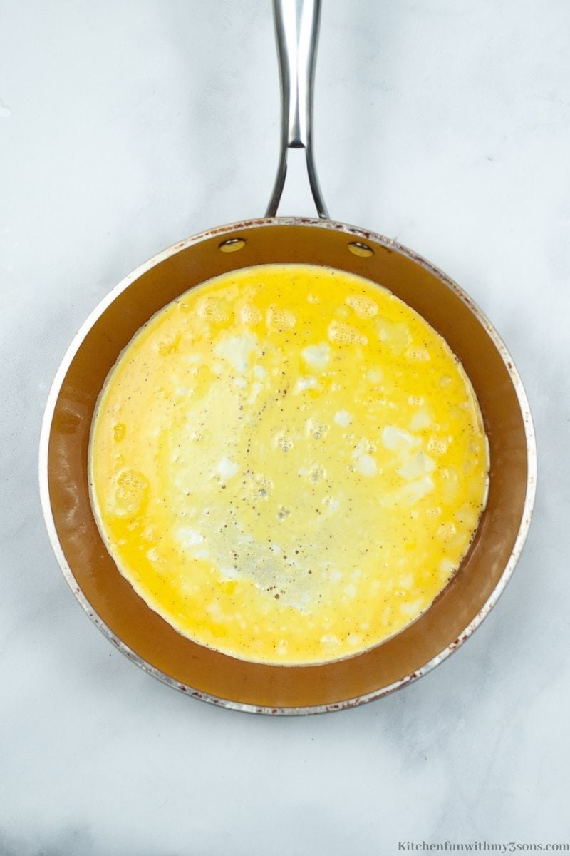 Cooking the eggs in a skillet.