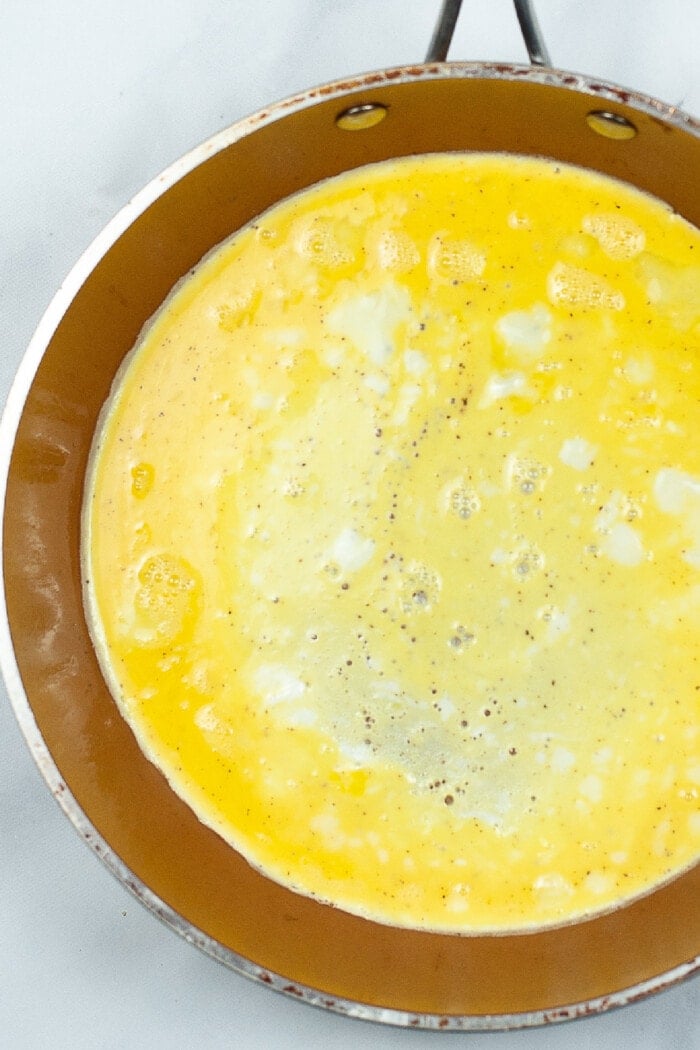 eggs cooking in a pan.