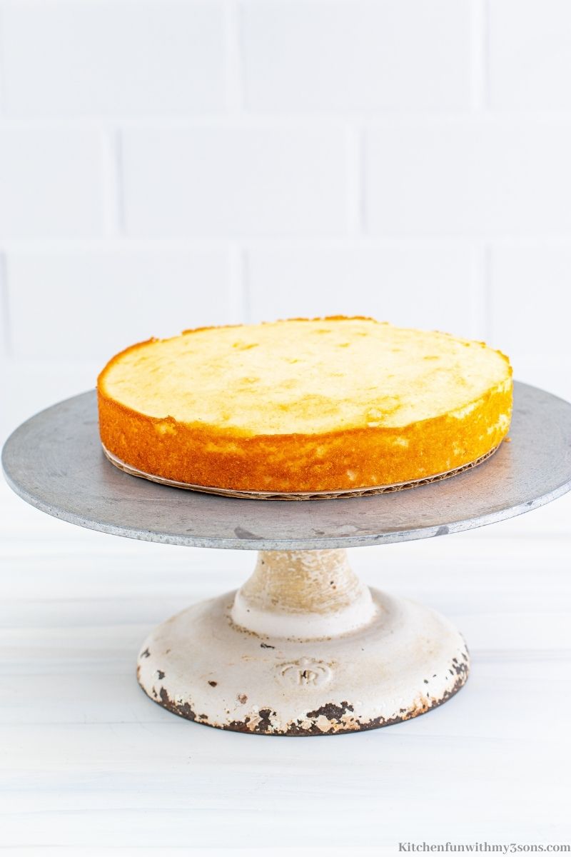 A round lemon cake on a cake platter