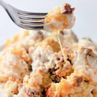 A bite of biscuits and gravy casserole on a fork