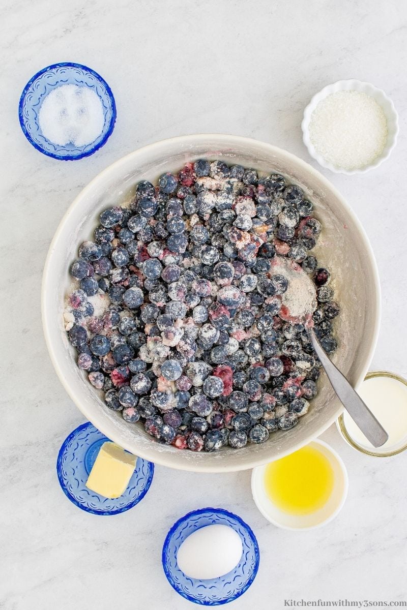 Combining the blueberries with other ingredients.