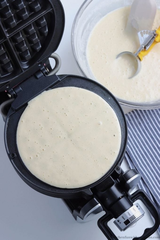 Pouring the batter into the waffle iron.