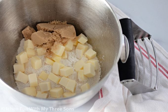 butter, flour, and brown sugar in a mixing bowl.