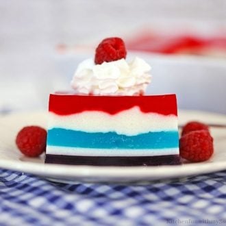 A side view of the jello on a checkered cloth.