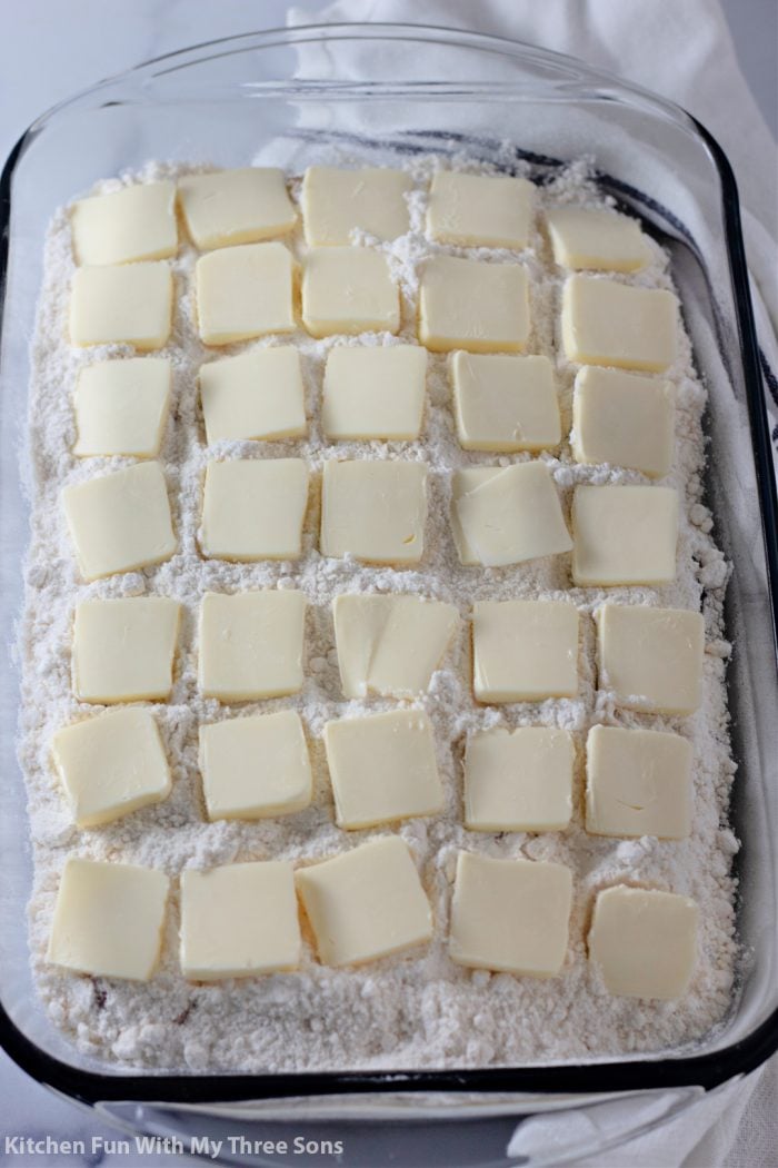 slices of butter over cake mix