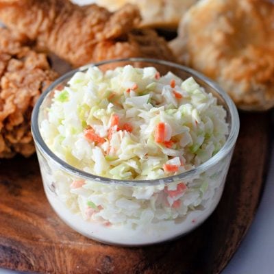 KFC Coleslaw close-up in front of fried chicken