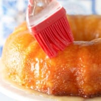 brushing the glaze over the Pineapple Cake