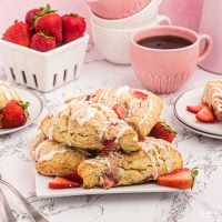 Strawberry Scones are a yummy homemade breakfast pastry that anyone can make. With fresh strawberries and a vanilla glaze on top.