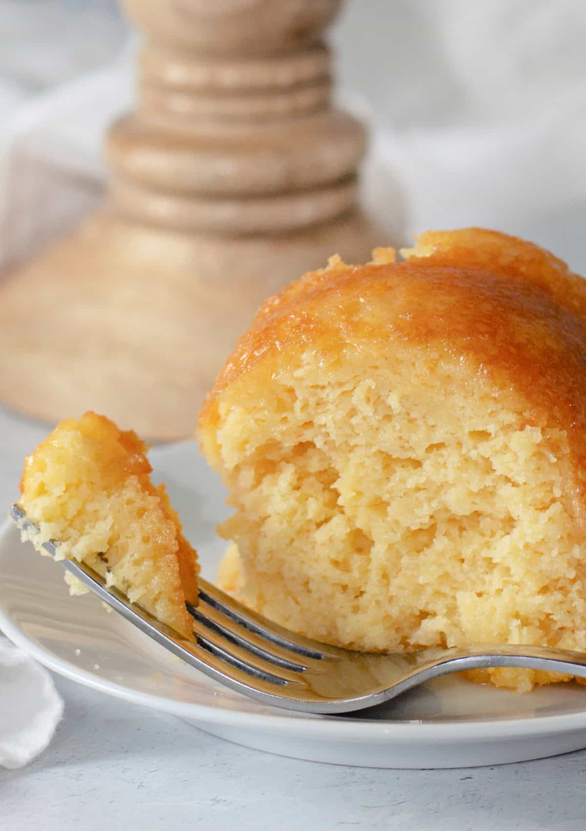 a bite on a fork of pineapple bundt cake