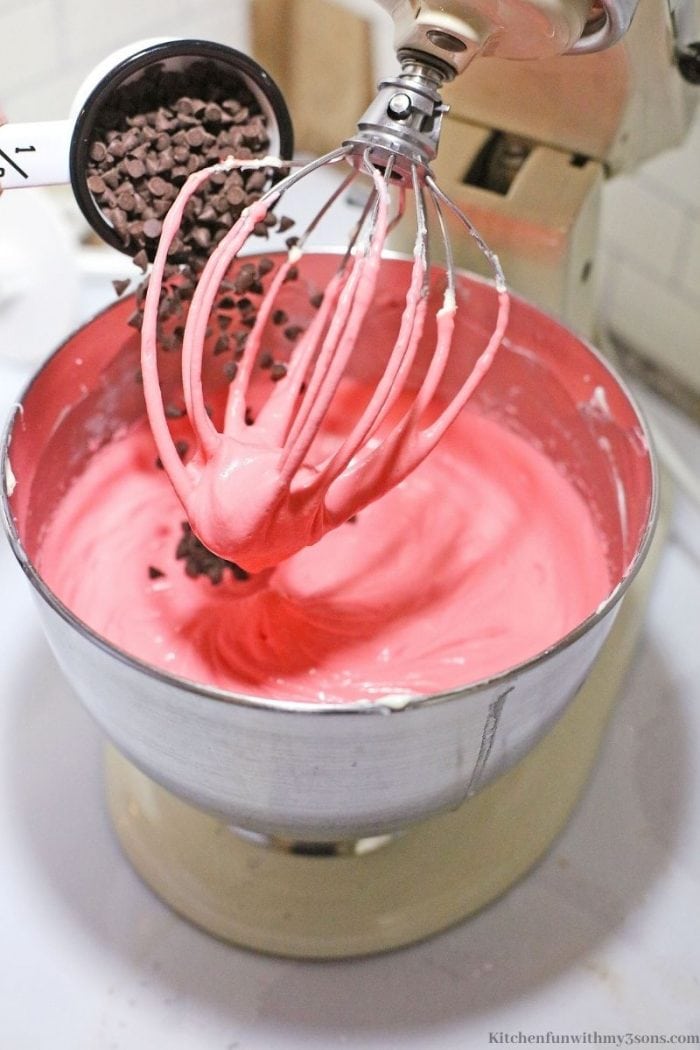 Combining the ingredients in an electric mixer.