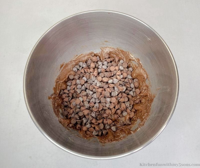 Adding the chocolate chips into the bowl.