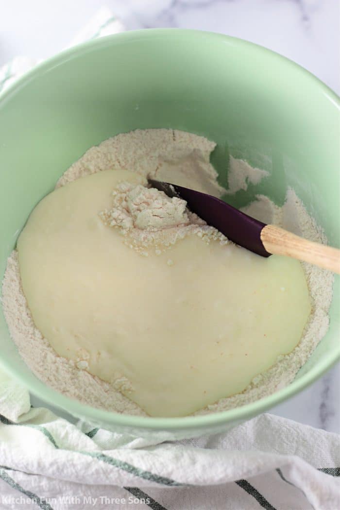 Biscuit dough comes together in a mixing bowl.
