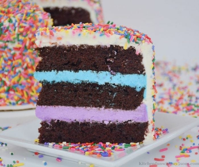 A piece of the cake showing off the blue and purple frosting inside.