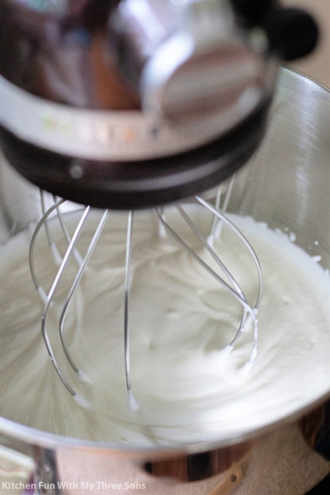 beating cream in a KitchenAid mixer.