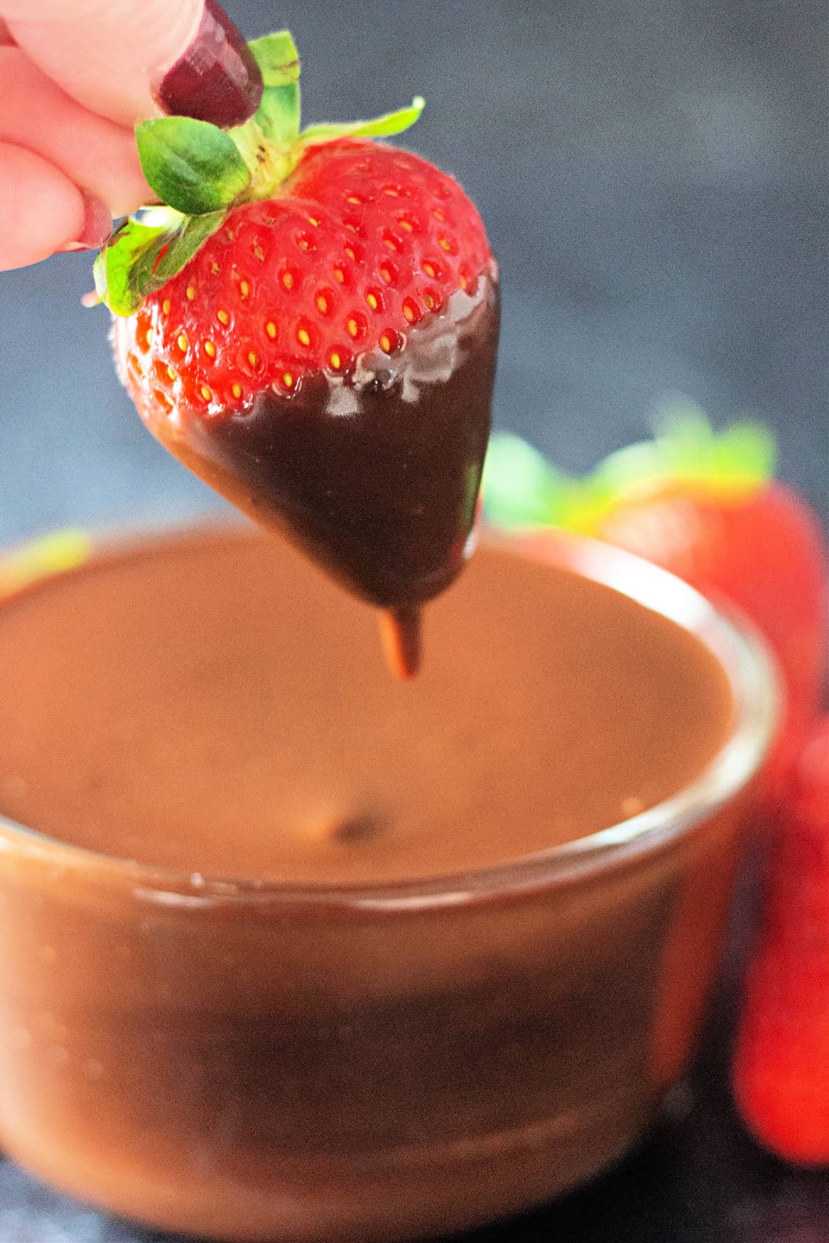 Ready in 5 minutes with just 6 basic ingredients, this Hot Fudge Sauce is rich, decadent, and incredibly chocolatey. A strawberry dipped in hot fudge