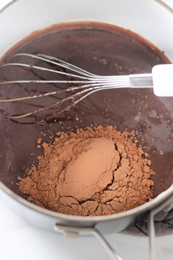 Ready in 5 minutes with just 6 basic ingredients, this Hot Fudge Sauce is rich, decadent, and incredibly chocolatey. Whisking cocoa powder into melted chocolate