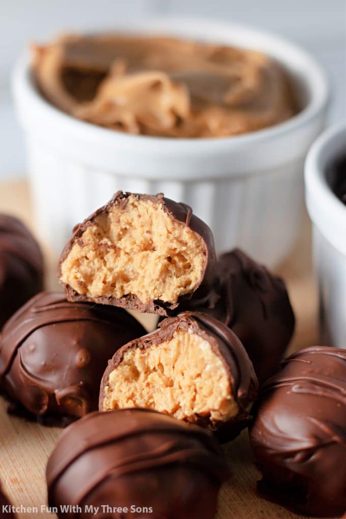 Peanut Butter Balls with Rice Krispies cut open and in a stack.