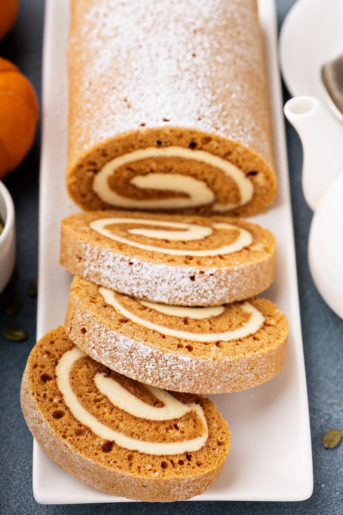 Pumpkin Cake Roll is everyones favorite fall dessert. This moist pumpkin cake is filled with a cream cheese filing and delicious pumpkin spices.