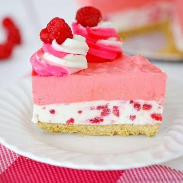 A slice of cheesecake on a serving plate.