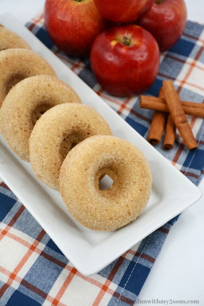 Doughnuts placed on a rectangle serving dish.