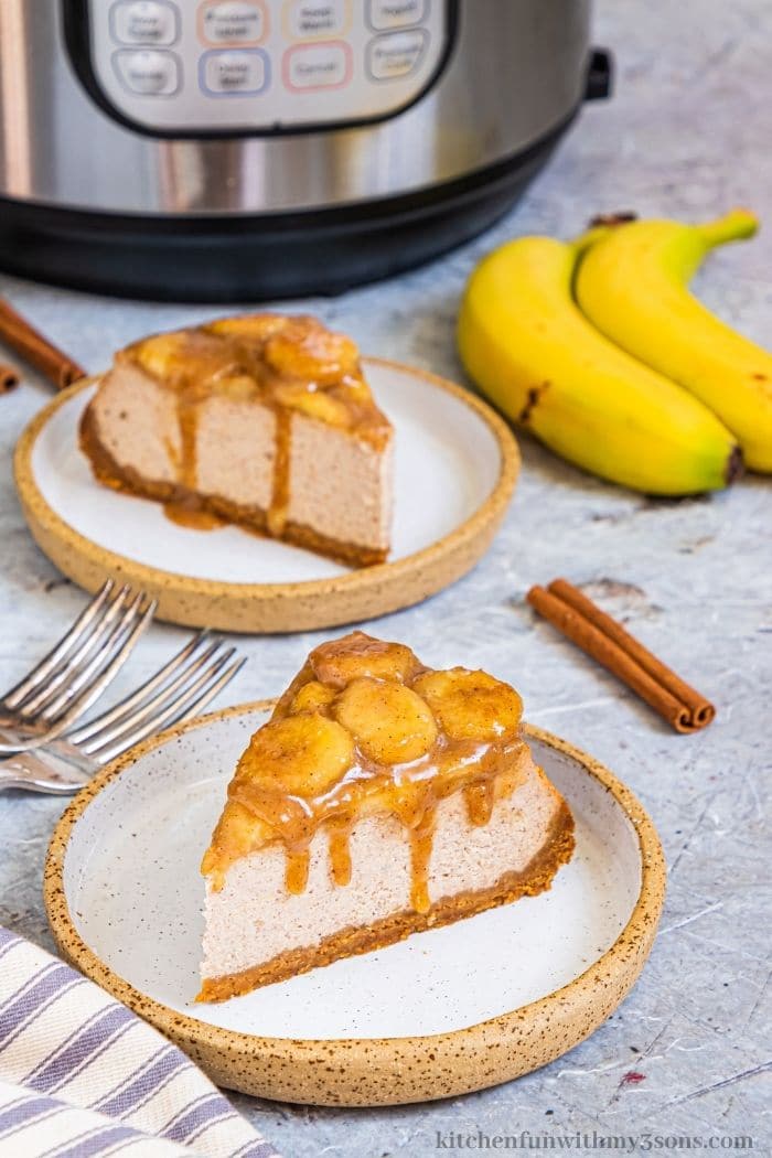 The pieces of cheesecake with two bananas on the side.