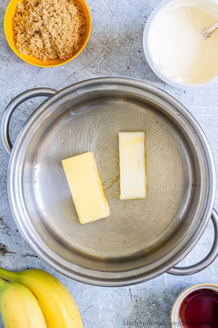 Adding butter into a saucepan.