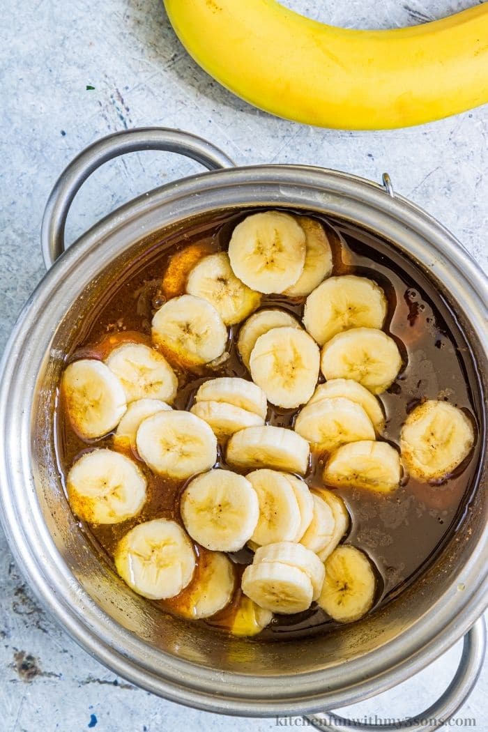 Adding the bananas into the mixture.