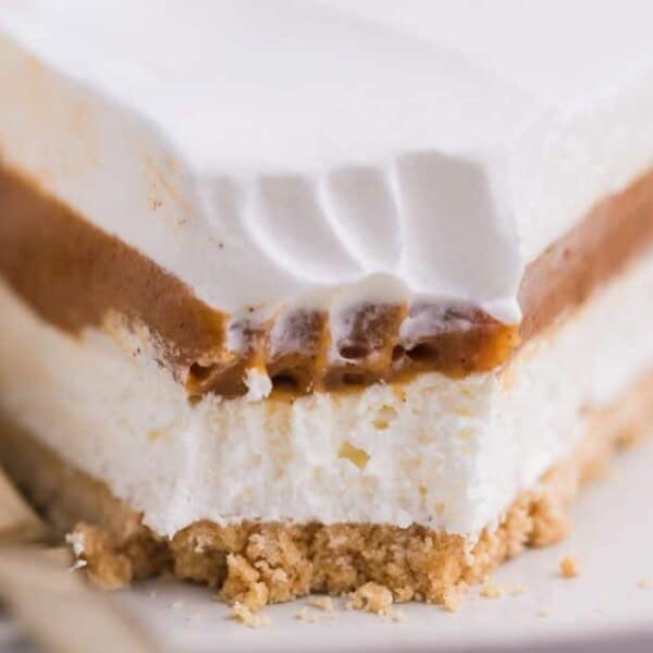 An up close shot of a pie with a bite taken out of it.