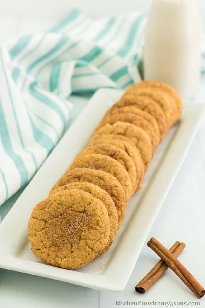 The cookies lined on a rectangle serving dish.