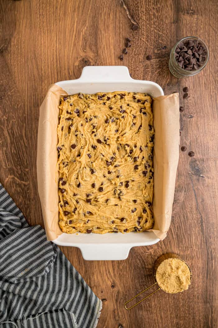 Chocolate chip dough in a baking pan