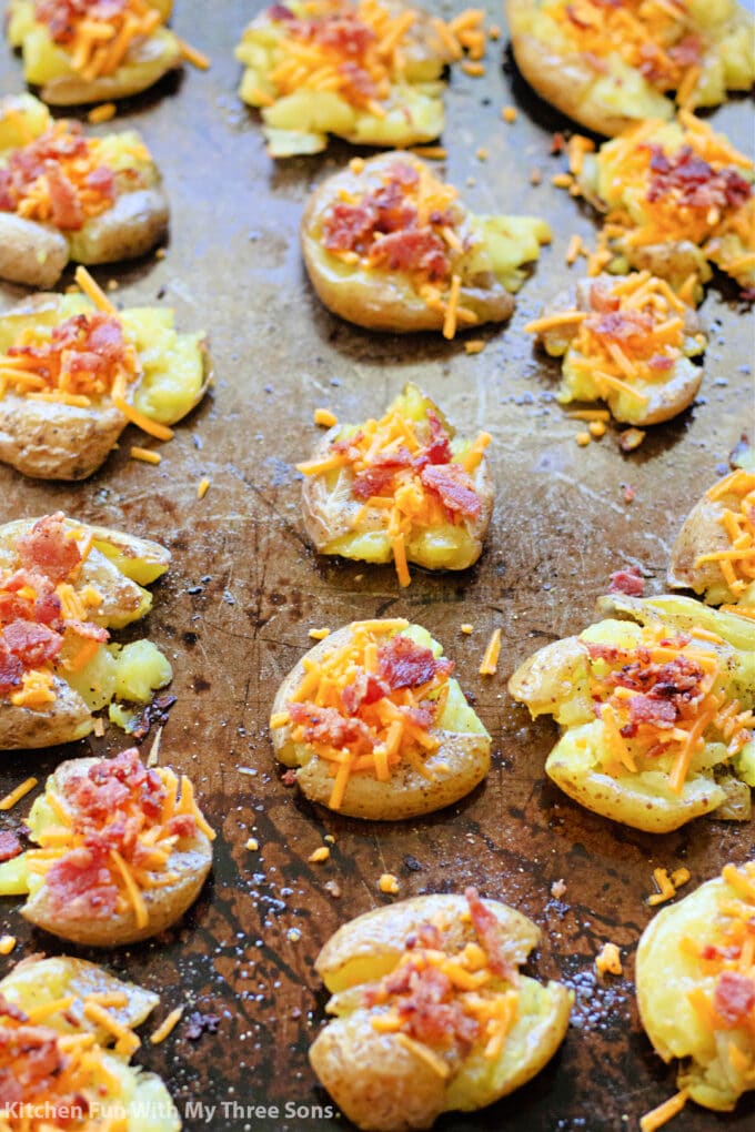 topping the potato with cheese and bacon.