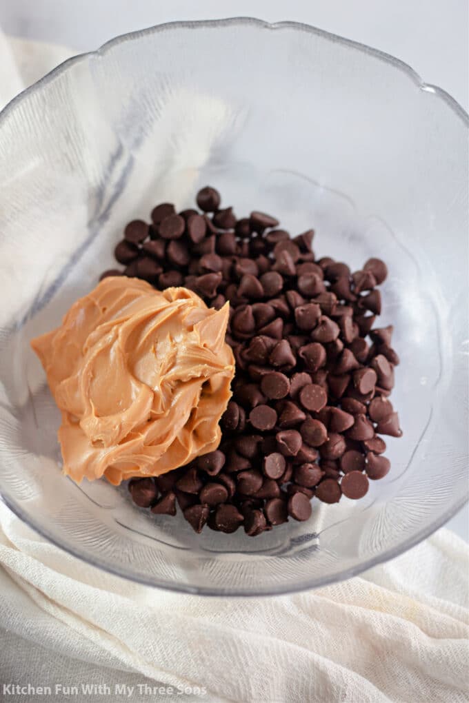 chocolate chips and peanut butter in a clear mixing bowl.