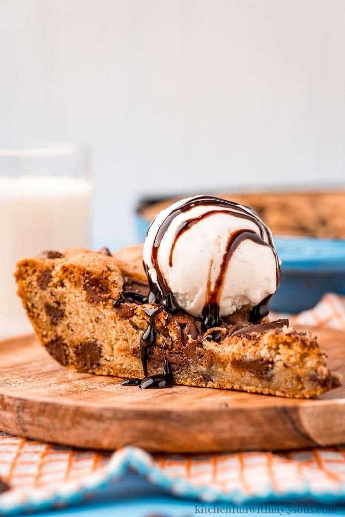 A piece of the skillet cookie with ice cream on top.