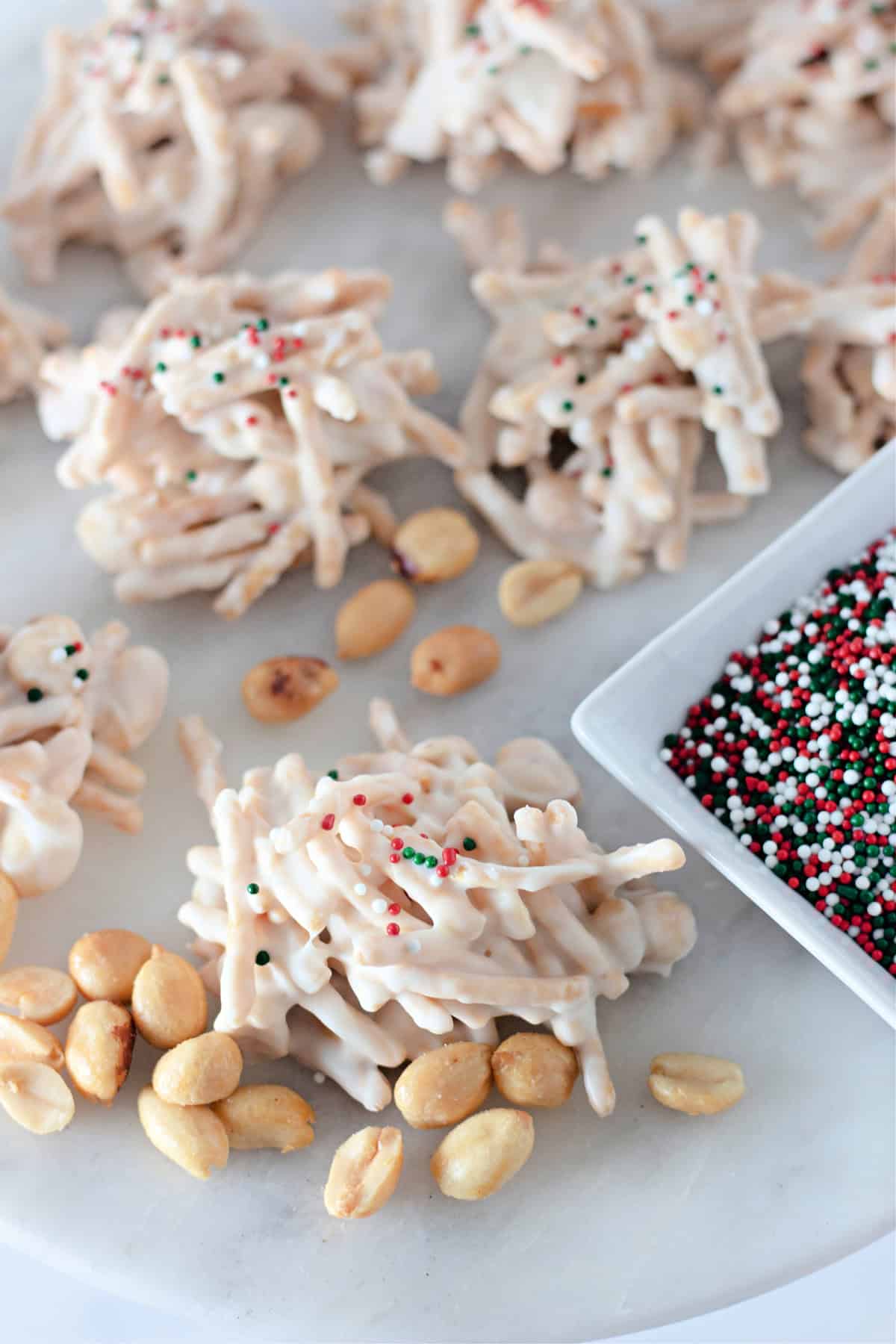 Overhead view of haystack cookies next to a bowl of sprinkles