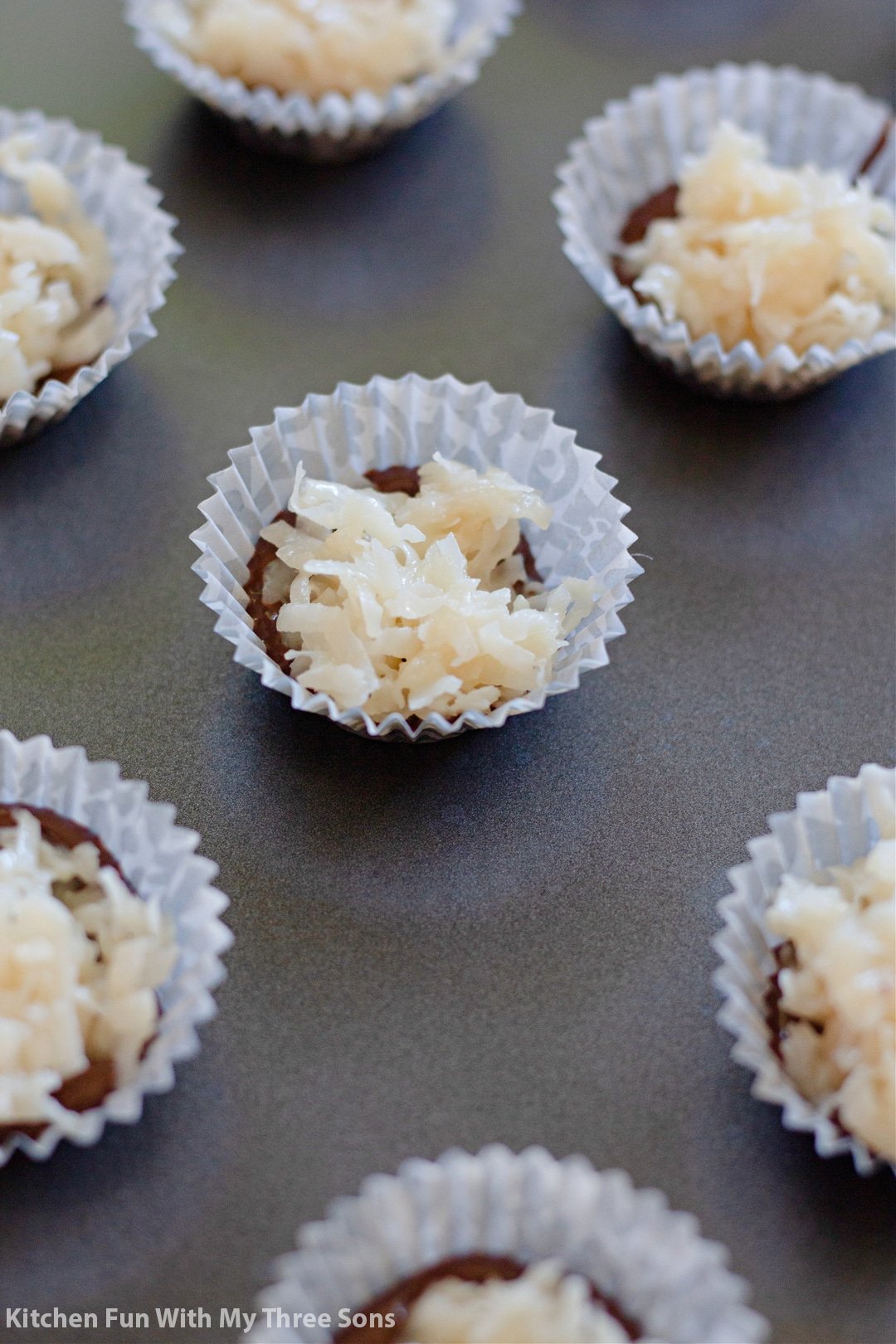 adding a layer of coconut filling.