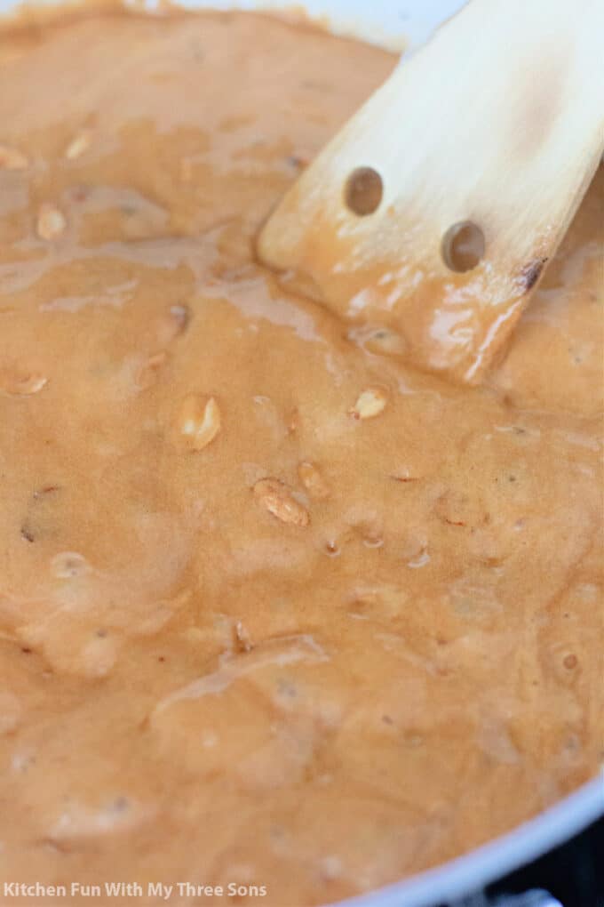 cooking the peanut brittle after adding baking soda.