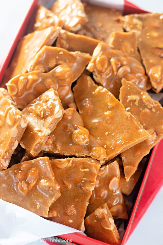 Homemade Peanut Brittle Recipe in a Christmas gift box.