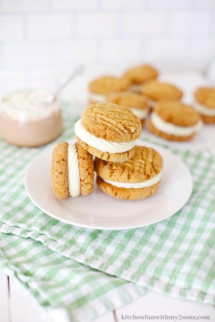 Cookies stacked on each other on a plate.