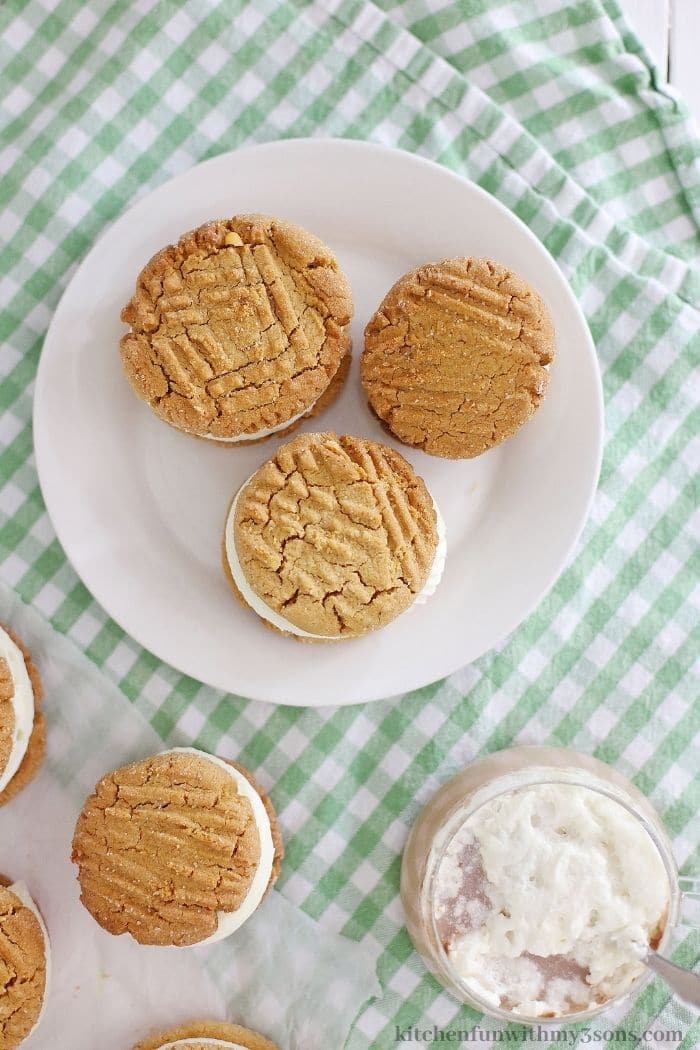 Sandwich cookies on a serving plate.