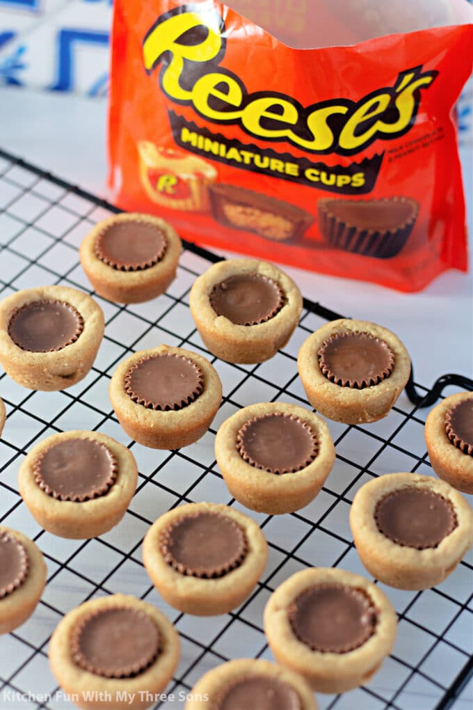 Peanut Butter Cup Cookies shown with a bag of Reese's Cups.