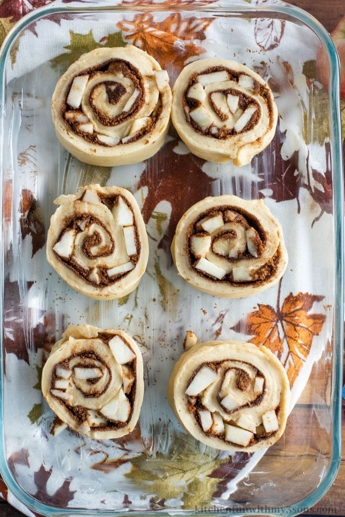 Rolling up the apples in the apple cinnamon buns.