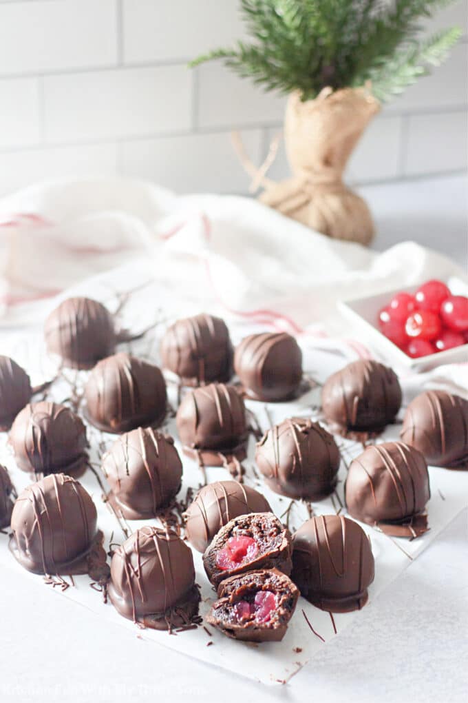 Chocolate Covered Cherry Brownie Balls on parchment paper.