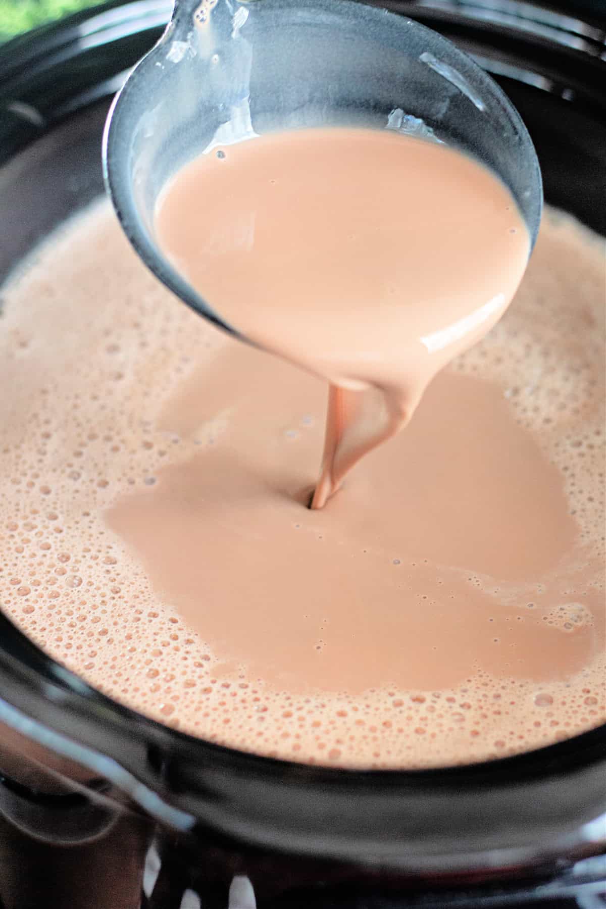 A ladle of slow cooker hot chocolate