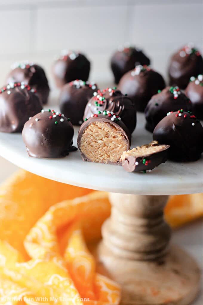 Nutter Butter Truffles on a white marble pedestal plate.