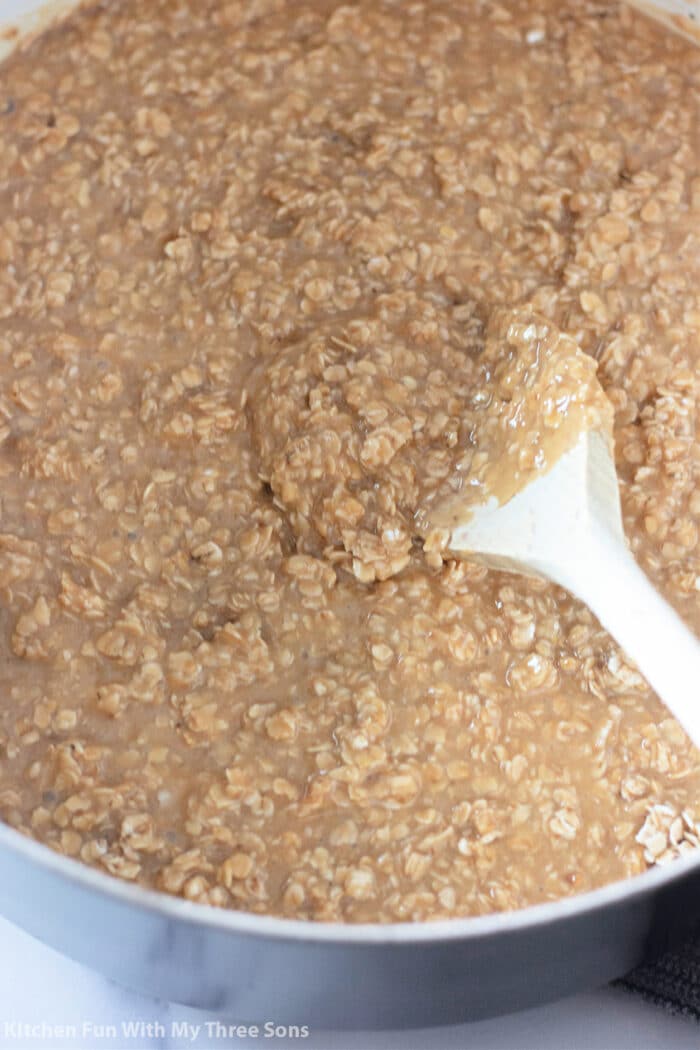 adding oats to the peanut butter mixture