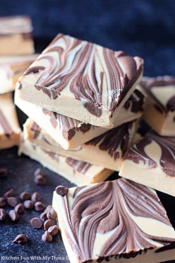 stacked Tiger Butter Fudge with chocolate chips.