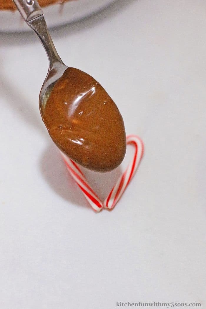 Adding the chocolate into the candy cane heart.