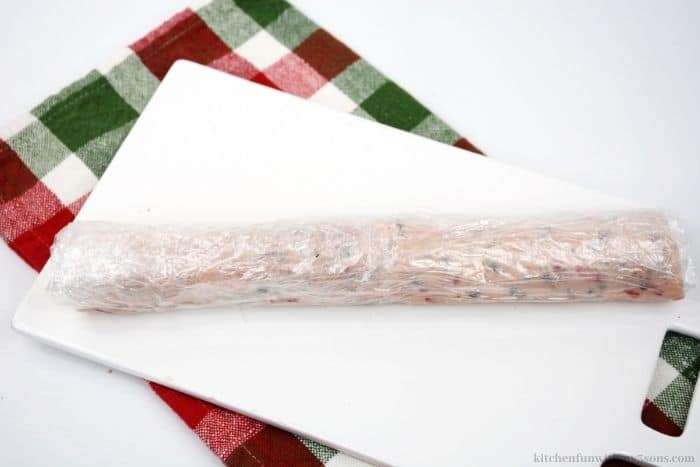 A log of the dough wrapped in plastic wrap.