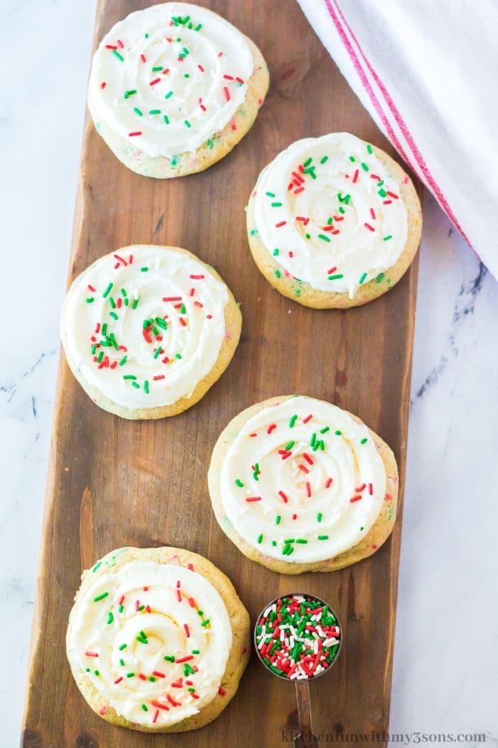 Christmas Funfetti Cookies on a wooden platter.